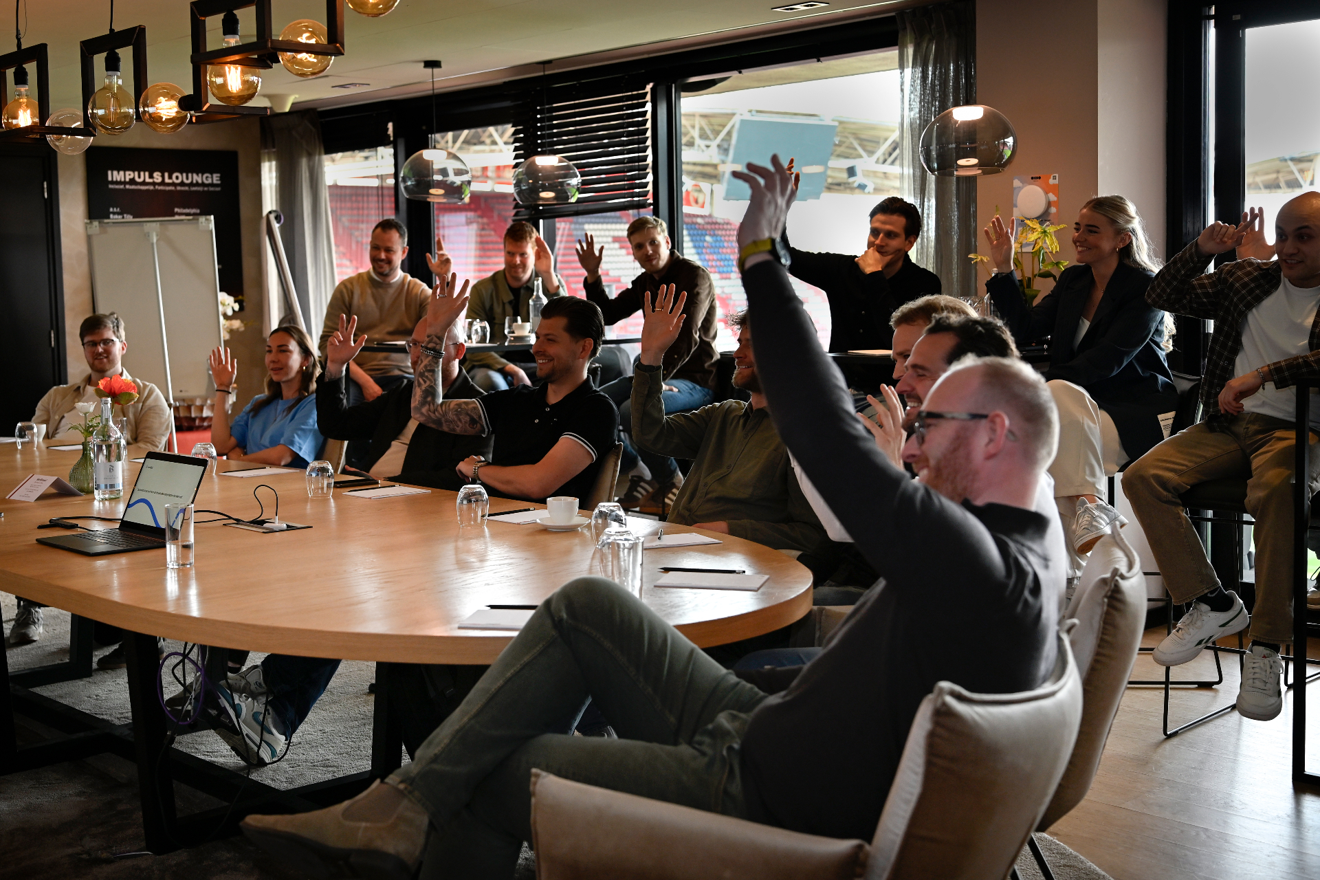 Partners voting on the best ideas with raised hands