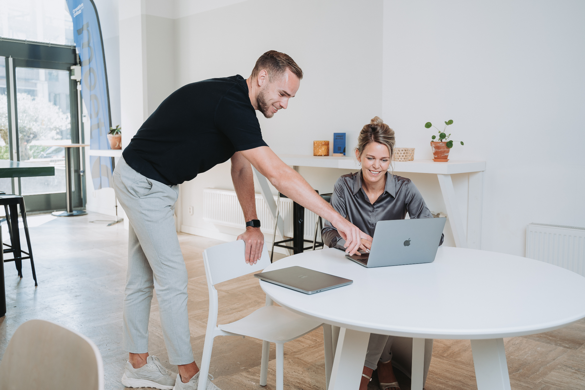 LeadBot colleagues working together behind a laptop